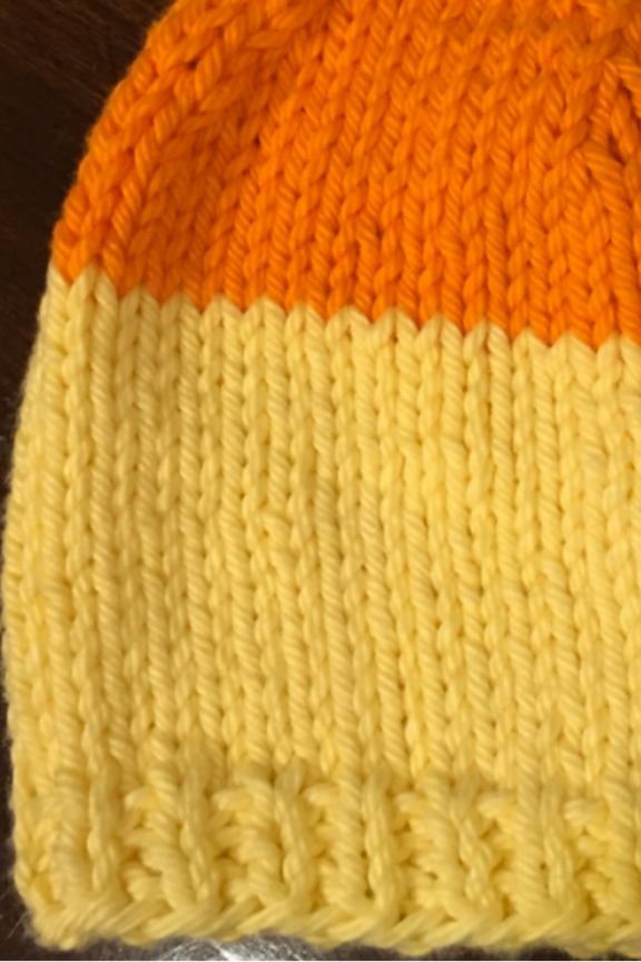 yellow and orange knit hat