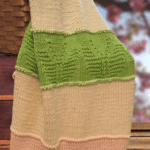 pink and green knit blanket with butterflies