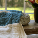 aqua and ivory knit blanket with basket