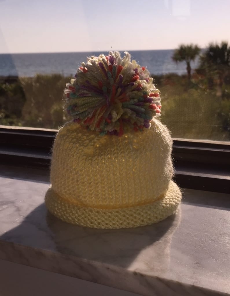 Pom pom baby hat