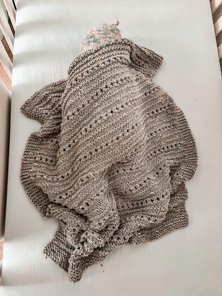 cuddly soft gray blanket on baby in crib