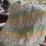 colorful blanket draped on a chair