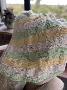 colorful blanket draped on a chair