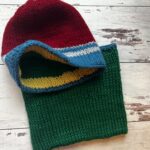 red and blue hat with green neckwarmer