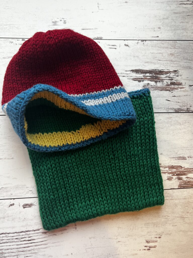 red and blue hat with green neckwarmer