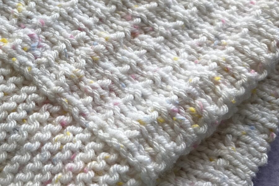 textured pink and white blanket