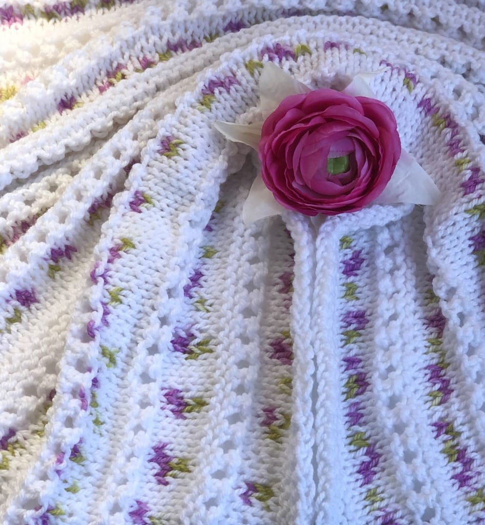 pink and white baby blanket