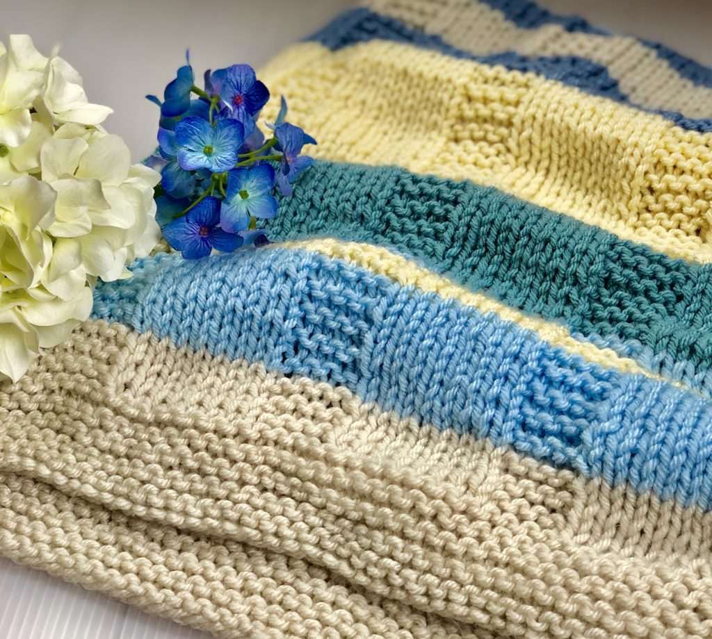 folded striped knit blanket