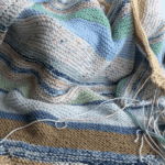 knit striped blanket in progress
