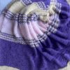 purple, pink and yellow blanket with bunny design