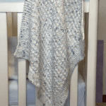 speckled white blanket draped over criv
