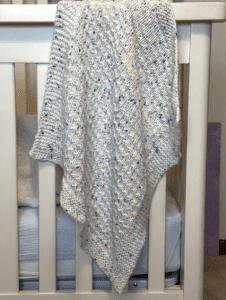 speckled white blanket draped over criv