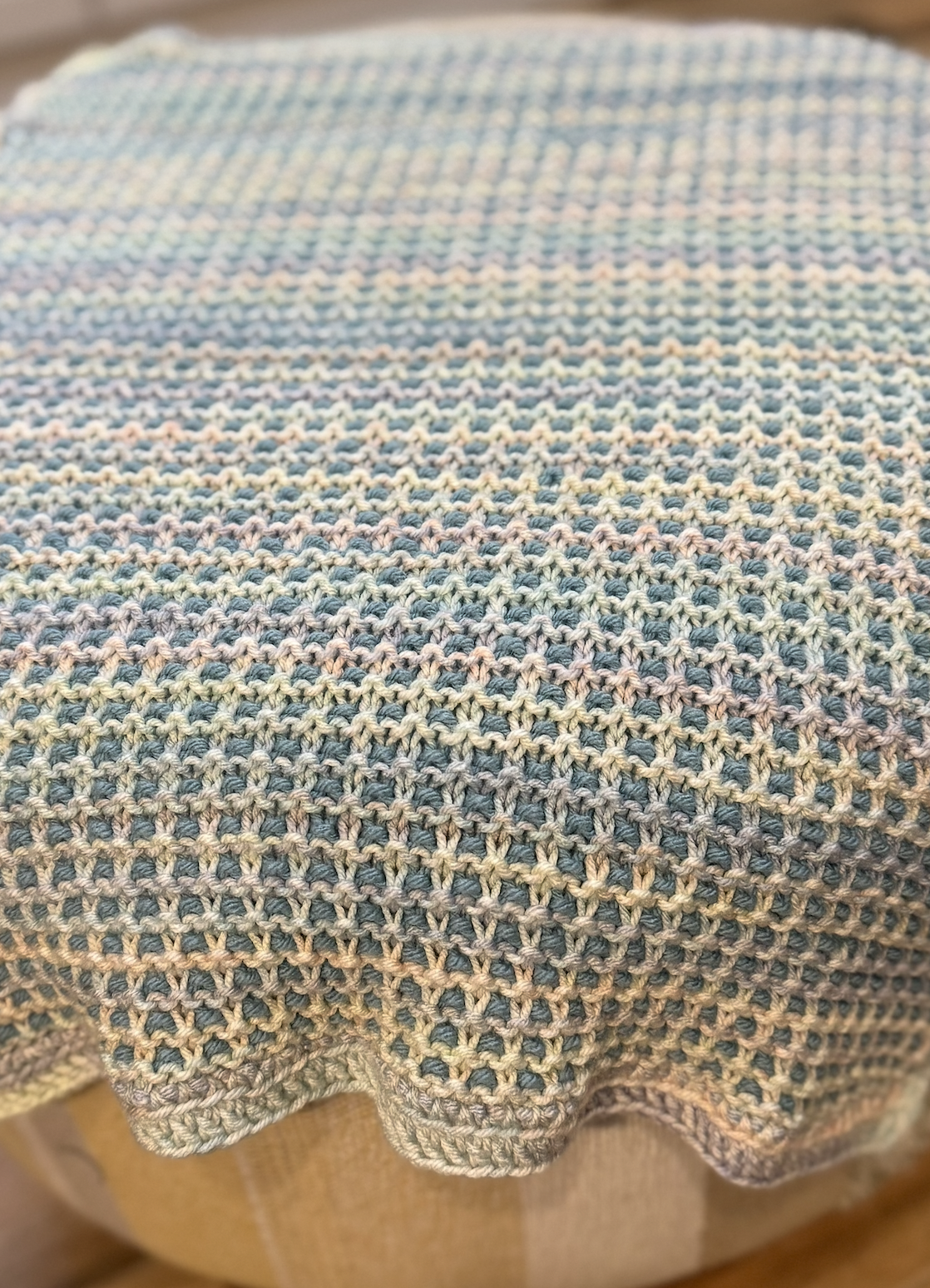 textured blanket on hassock