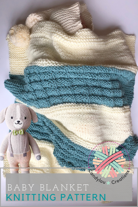 baby with aqua and cream blanket and baby