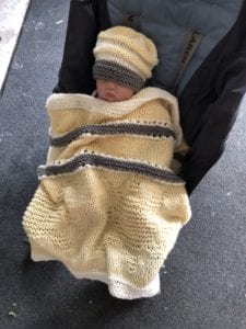 Baby and blanket in stroller