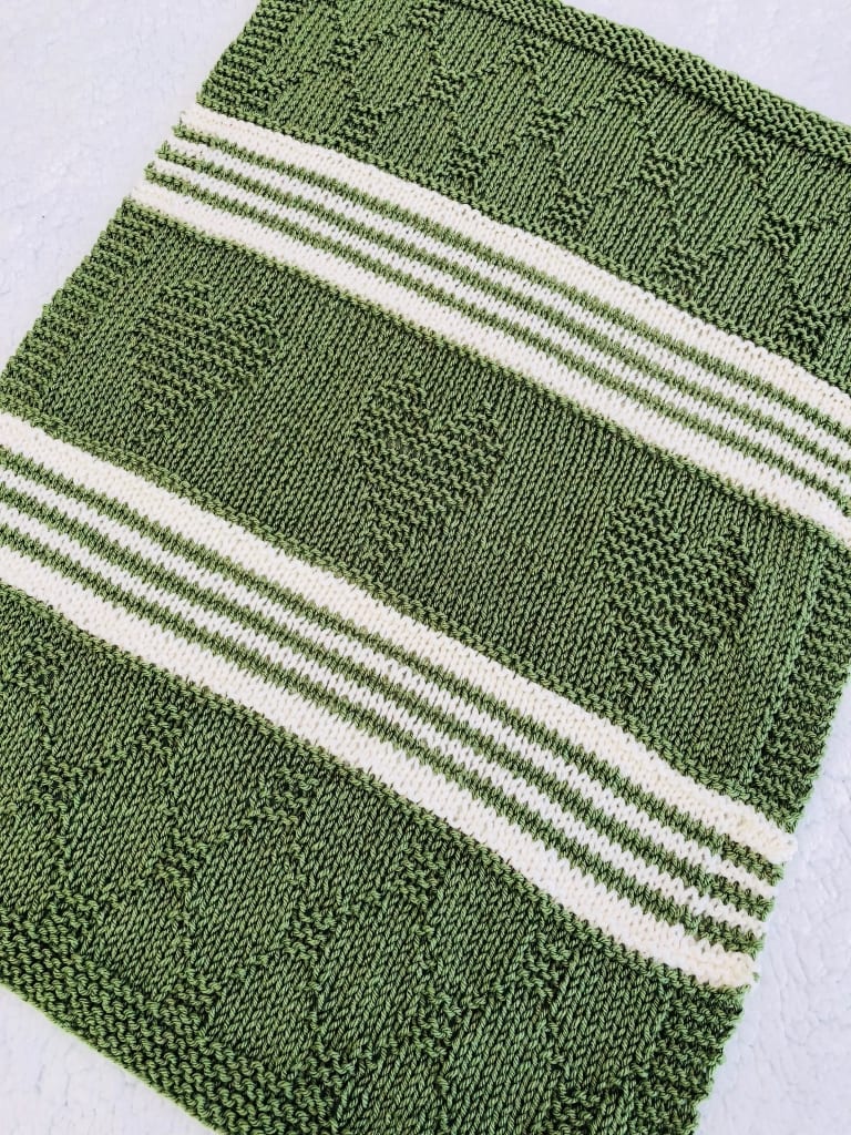 green and white pattern baby blanket