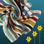 colorful striped blanket with 3 flowers