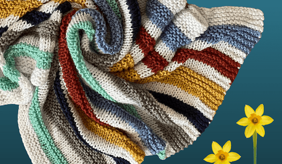 colorful striped blanket with 3 flowers