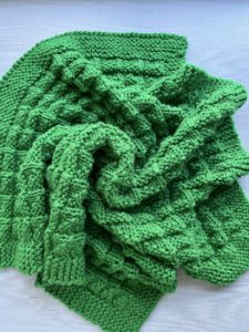 green textured baby blanket