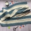 Cuddly Soft Baby Blanket knit with candle and scissors