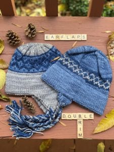 2 blue and gray knit hats with double brim and earflaps