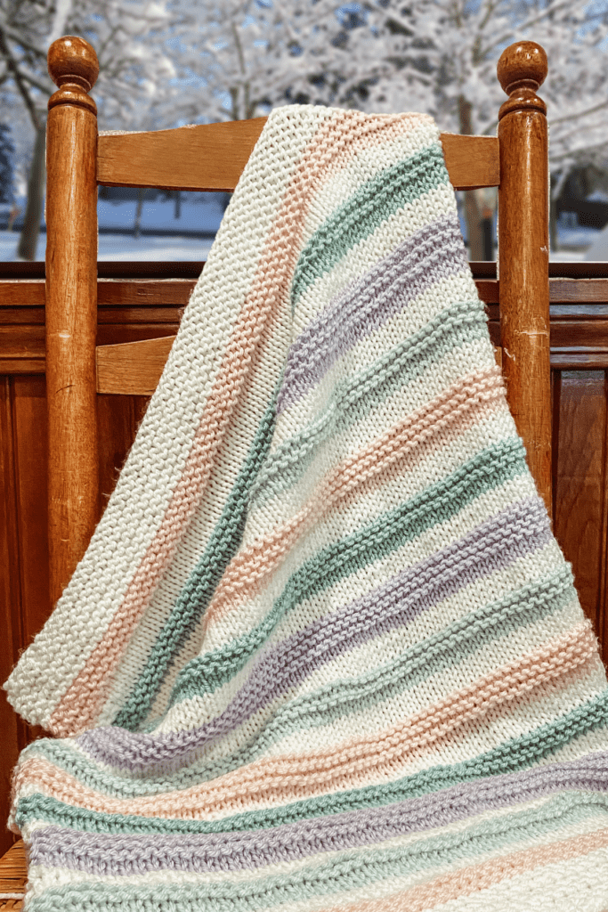 striped knit blanket draped on chair