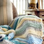 knit blanket draped on chair