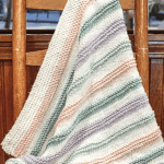 striped blanket draped on chair