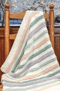 striped blanket draped on chair