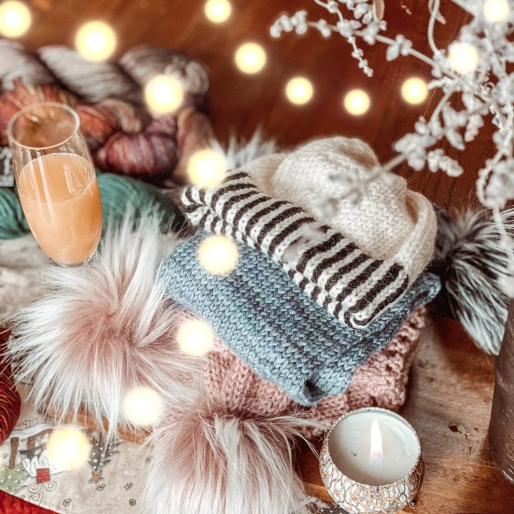 beanie with black and white striped brim and white body