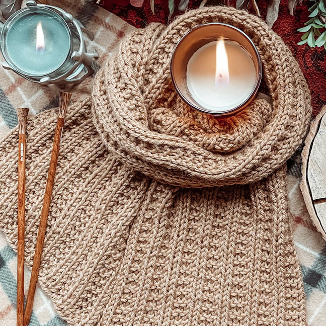 tan knit scarf with candles