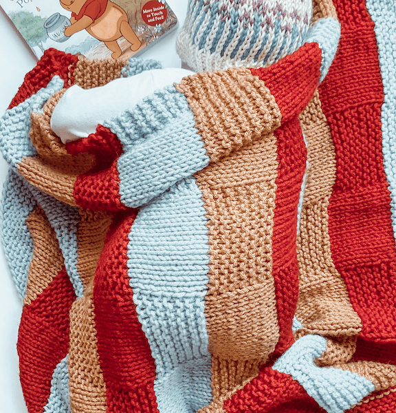 red blue and gold basketweave blanket