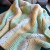 yellow, green and white basketweave style baby blanket