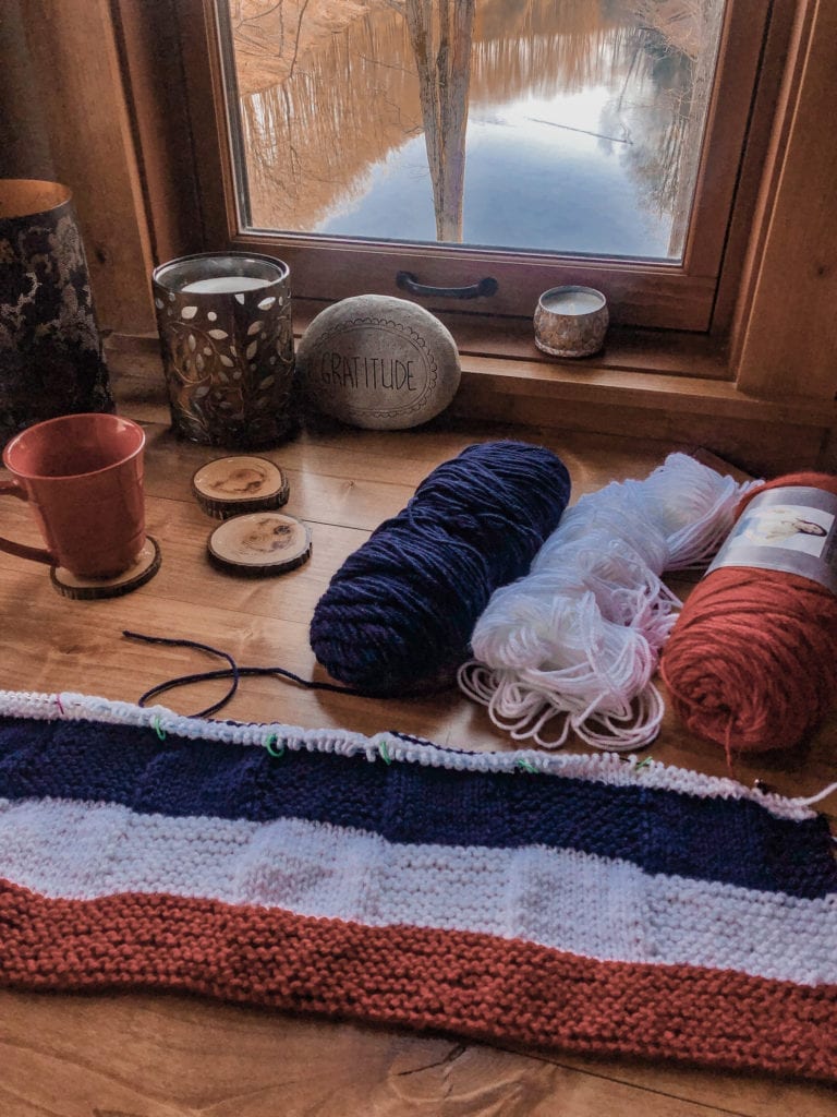 red white and blue blanket and yarn