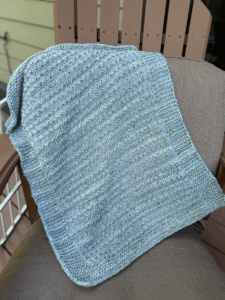 handknit baby blanket in aqua