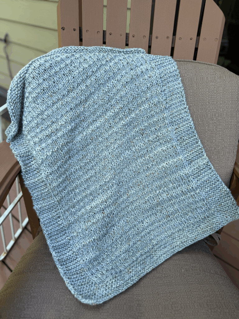 handknit baby blanket in aqua
