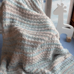 handknit blanket draped across chair