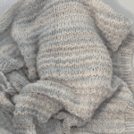 baby blanket covering baby in crib
