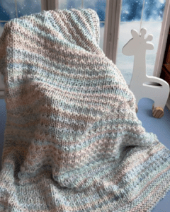 handknit blanket draped across chair