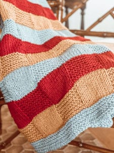 red yellow and blue handknit blanket