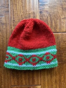 red, green and white knit hat